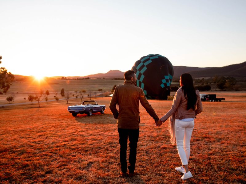 Couple arriving for a sunrise hot air balloon ride with Beyond Ballooning in the Hunter Valley