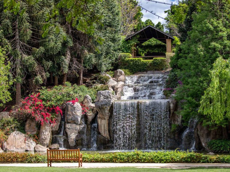 A majestic 10 metre high waterfall in the scenic Sunken Garden located at Hunter Valley Gardens, Pokolbin